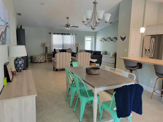 a bedroom with a bed and a table