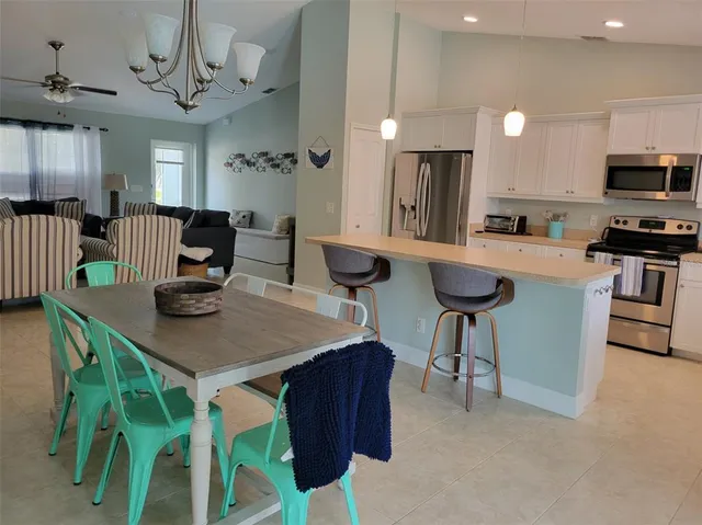 a view of a hallway and a livingroom with a mirror