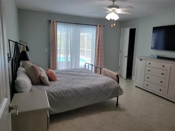 a bathroom with a sink a toilet a mirror and shower