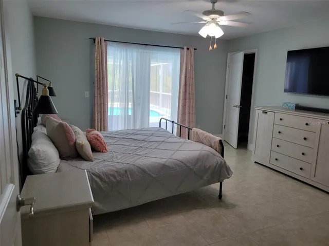 a bathroom with a sink a toilet a mirror and shower