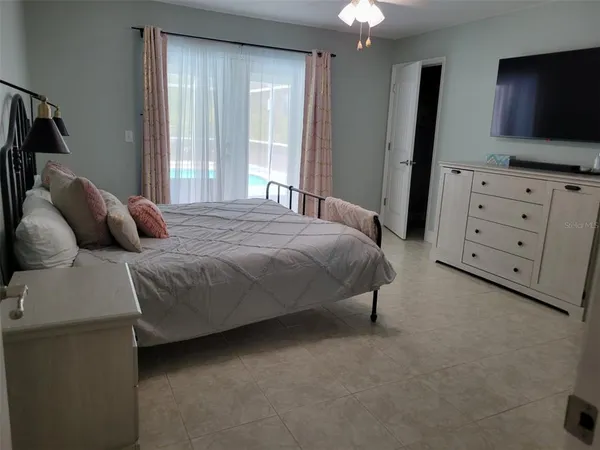 a bathroom with a granite countertop sink a mirror and a picture on the wall