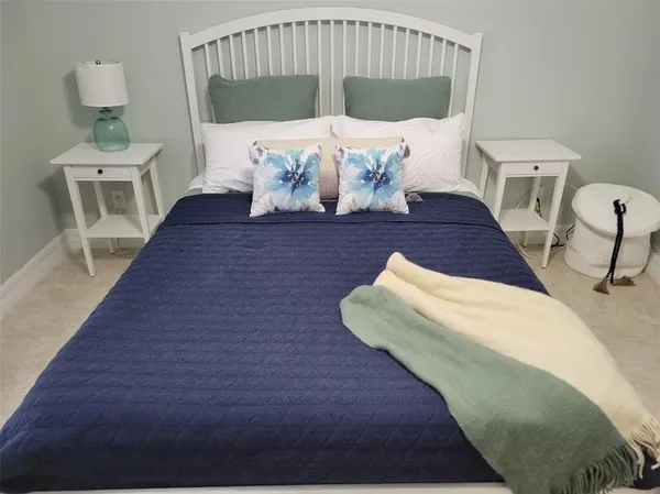 a view of a house with a big yard and a large tree