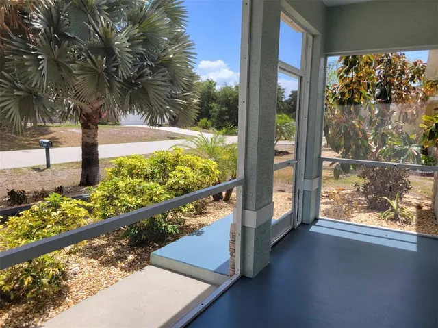 a living room with furniture a fireplace and a chandelier