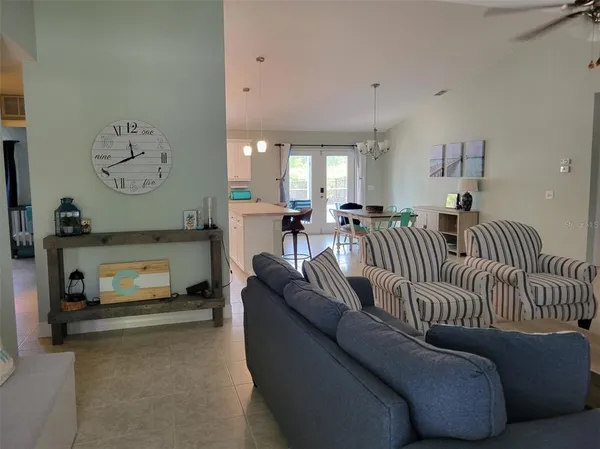 a kitchen with stainless steel appliances granite countertop a sink refrigerator and microwave