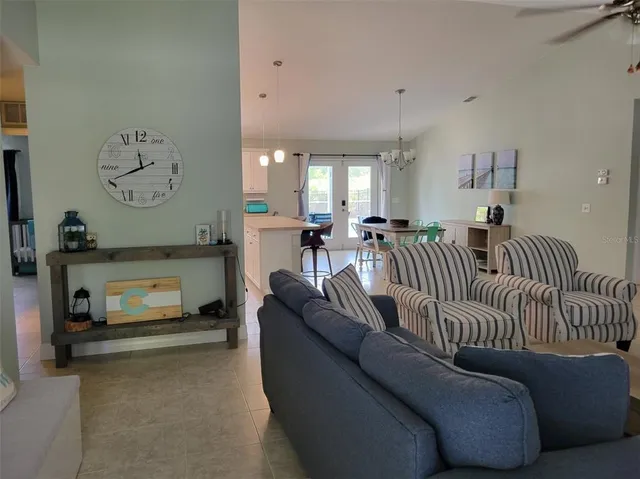 a kitchen with stainless steel appliances granite countertop a sink refrigerator and microwave