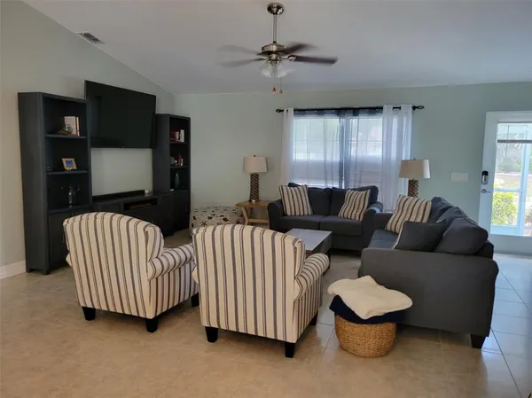 a kitchen with stainless steel appliances granite countertop white cabinets a sink and dishwasher