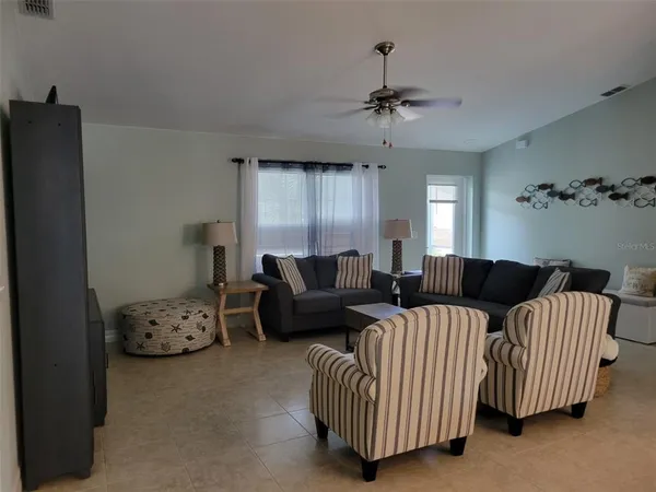 a kitchen with white cabinets sink and white appliances