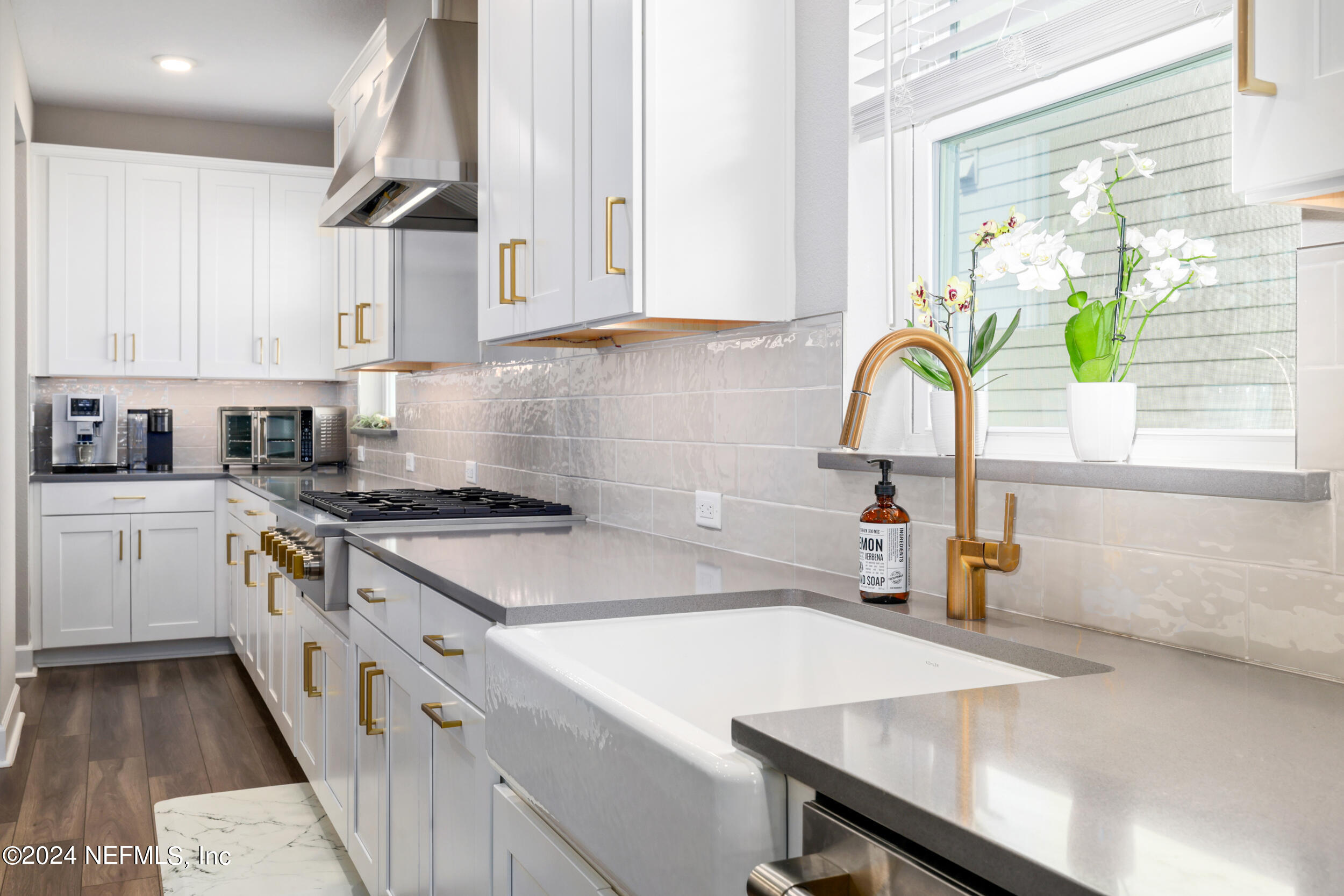 98 Sumter Pl Street St. Augustine, FL 32092 - Photo 15 of 84 a kitchen with a stove a sink and a cabinets