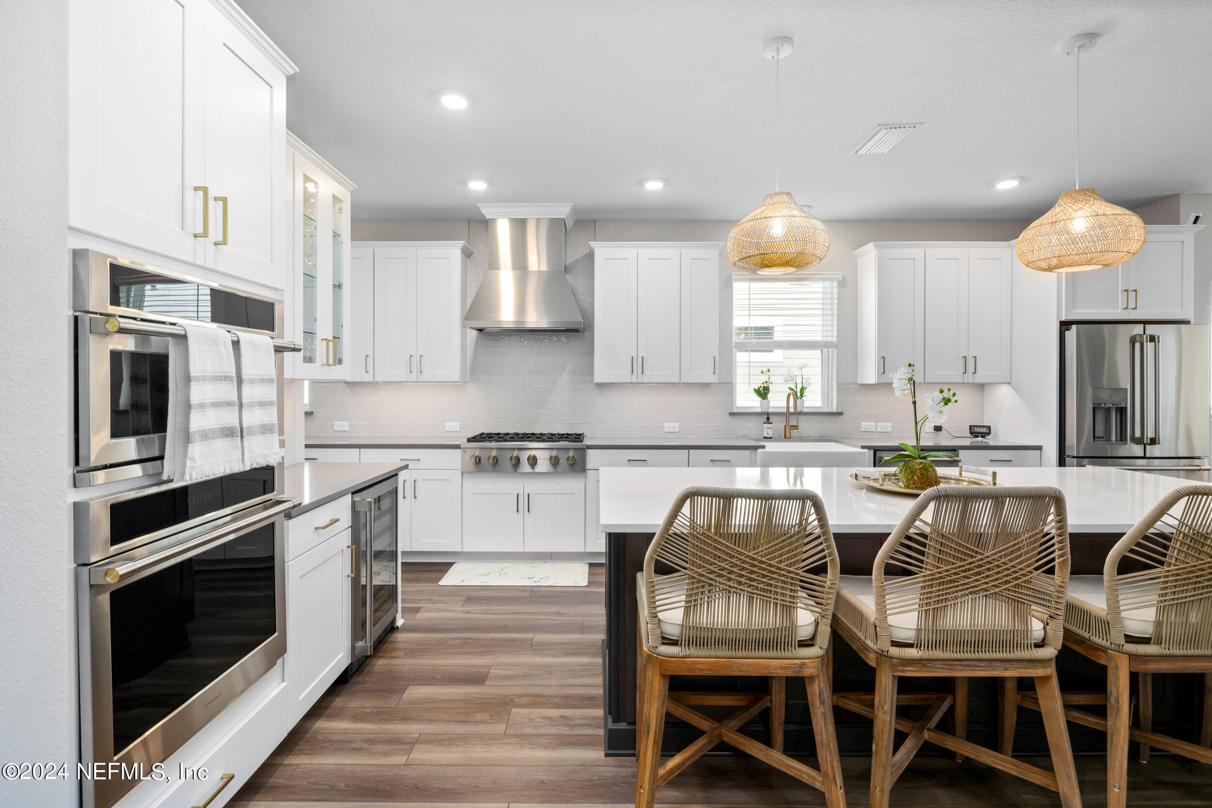 98 Sumter Pl Street St. Augustine, FL 32092 - Photo 17 of 84 a kitchen with granite countertop a table chairs microwave and cabinets