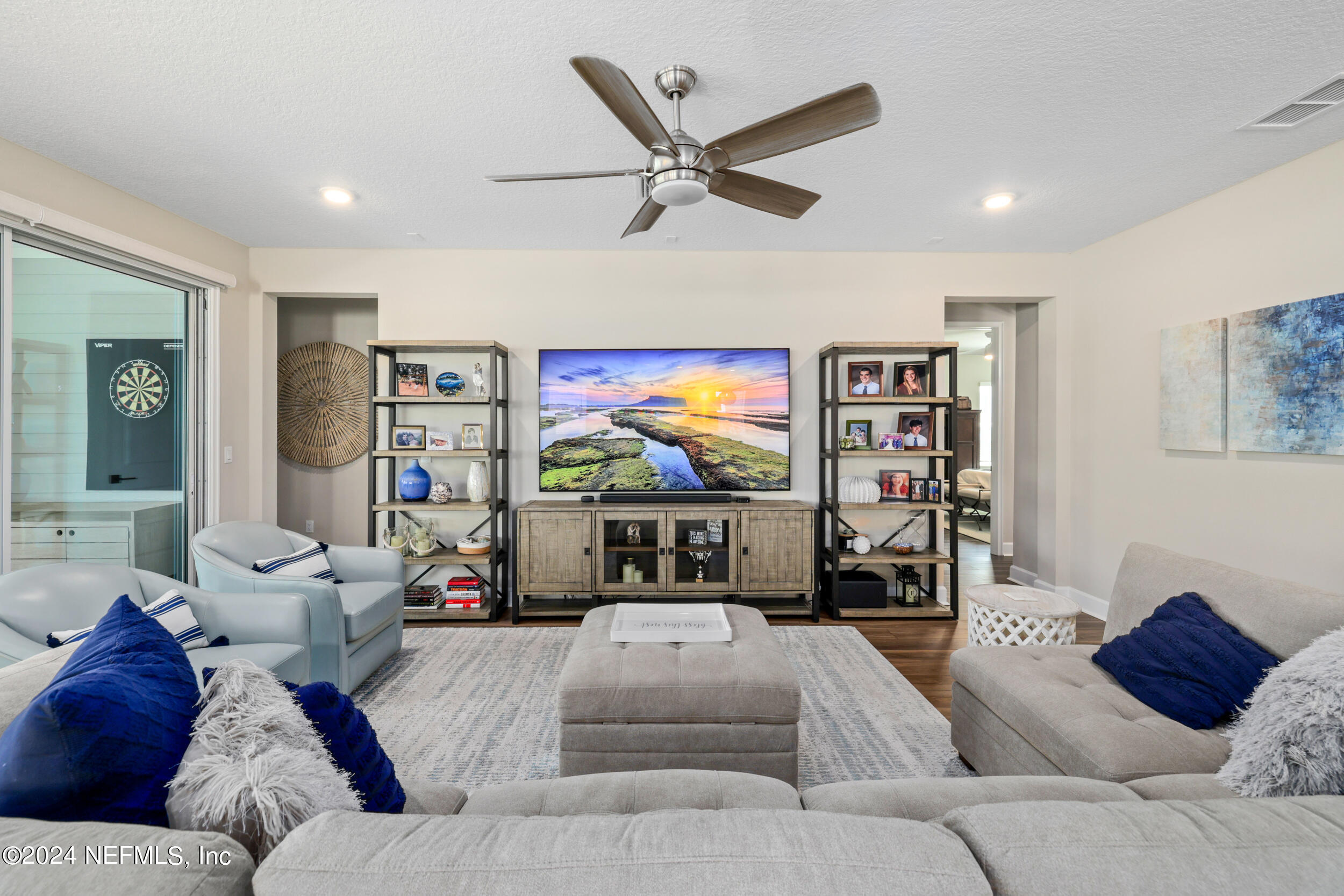 98 Sumter Pl Street St. Augustine, FL 32092 - Photo 29 of 84 a living room with furniture and a flat screen tv