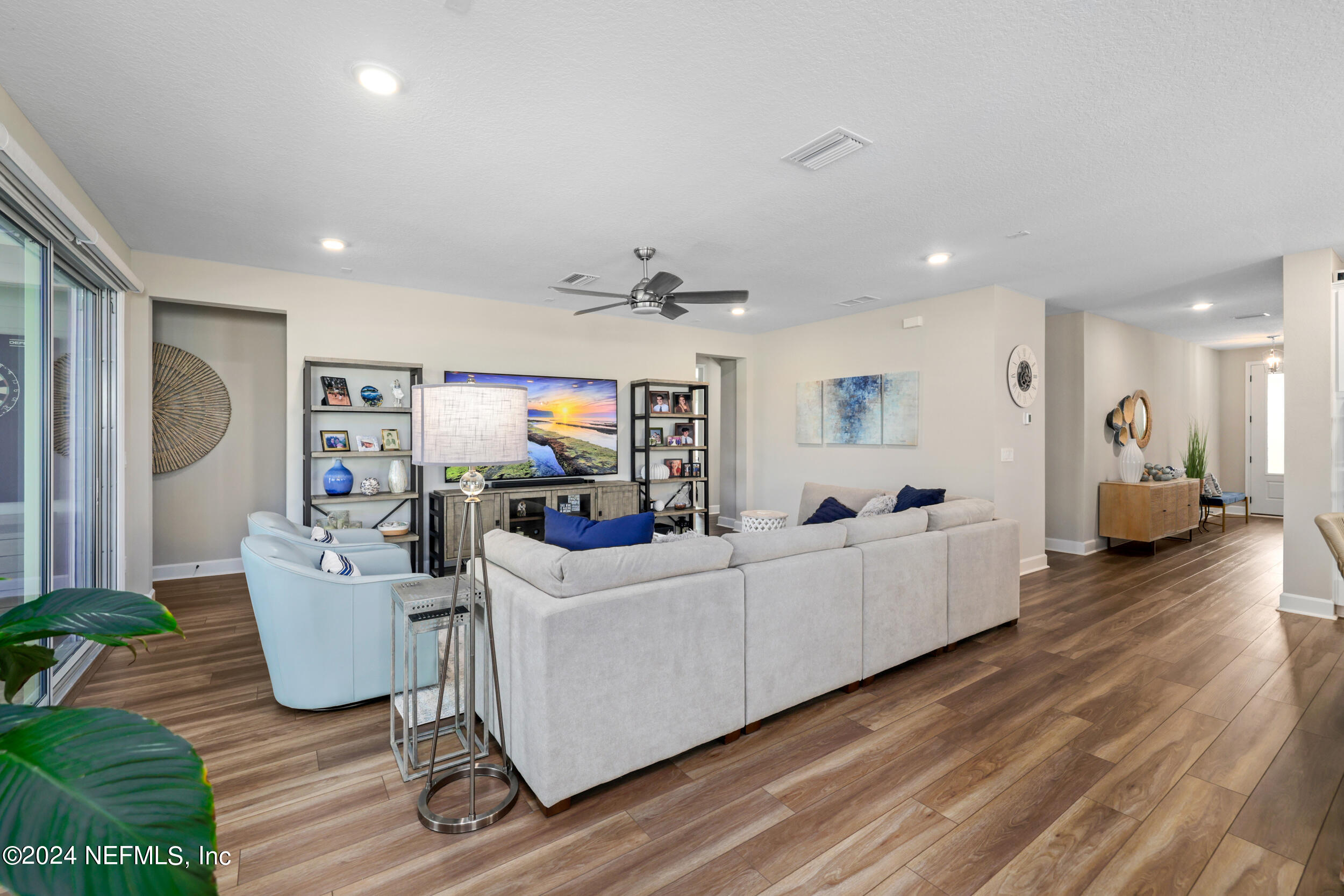 98 Sumter Pl Street St. Augustine, FL 32092 - Photo 30 of 84 a living room with furniture and a flat screen tv