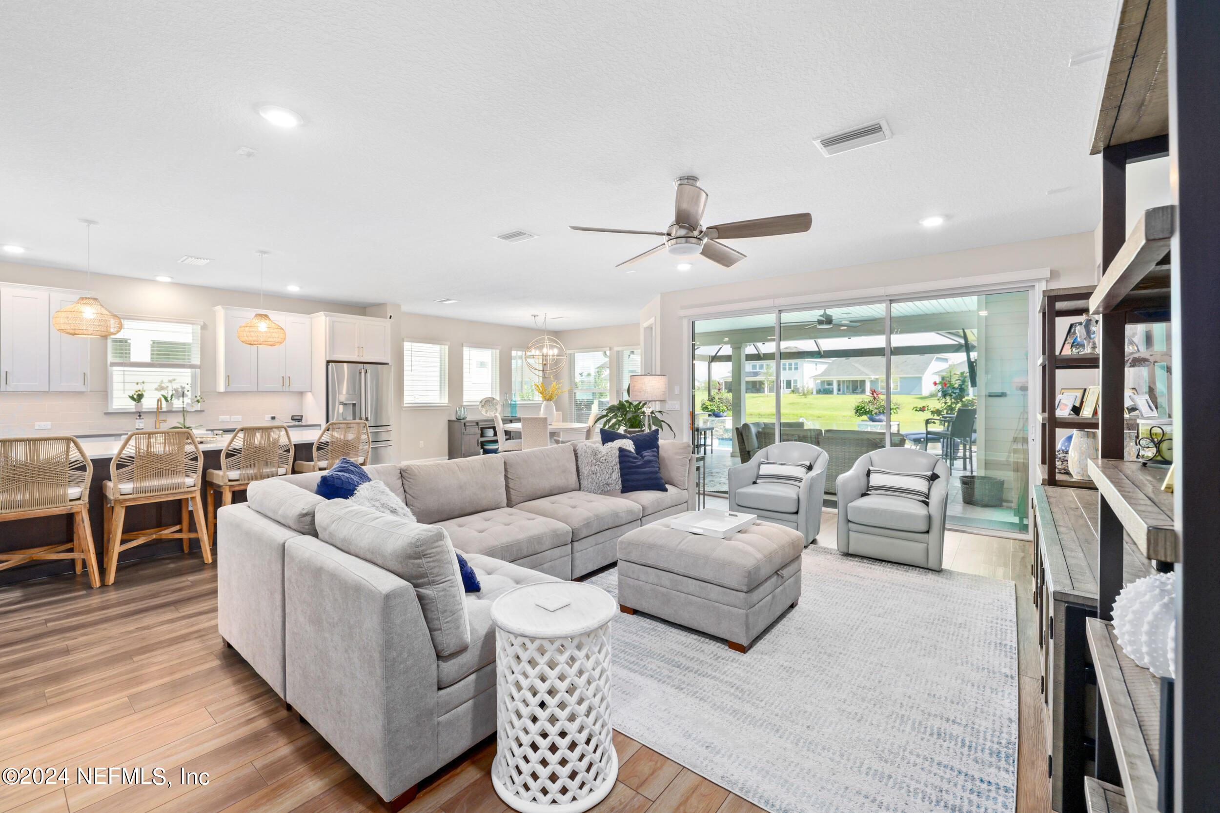 98 Sumter Pl Street St. Augustine, FL 32092 - Photo 32 of 84 a living room with furniture wooden floor and a large window