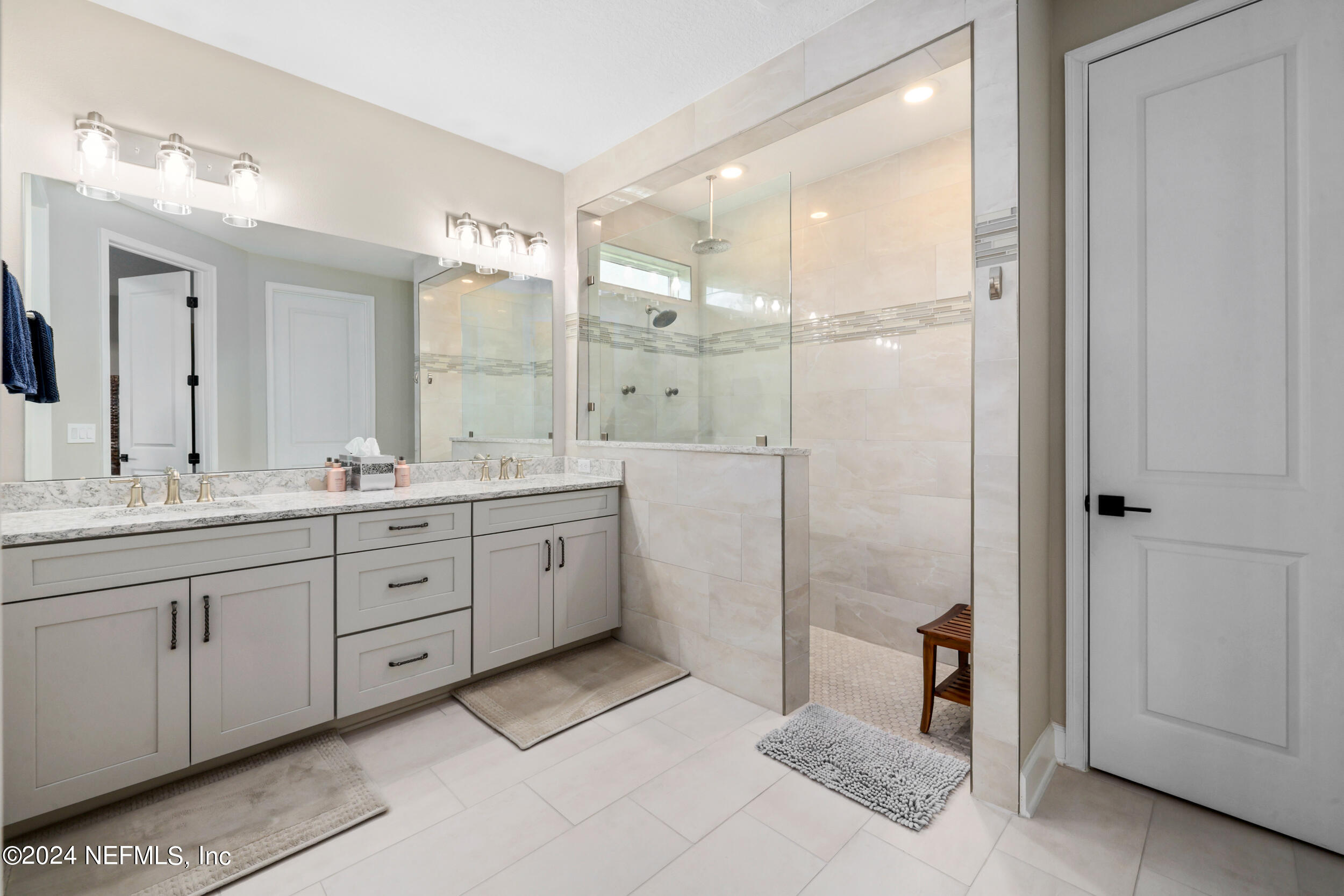 98 Sumter Pl Street St. Augustine, FL 32092 - Photo 58 of 84 a spacious bathroom with a double vanity sink a mirror and a shower