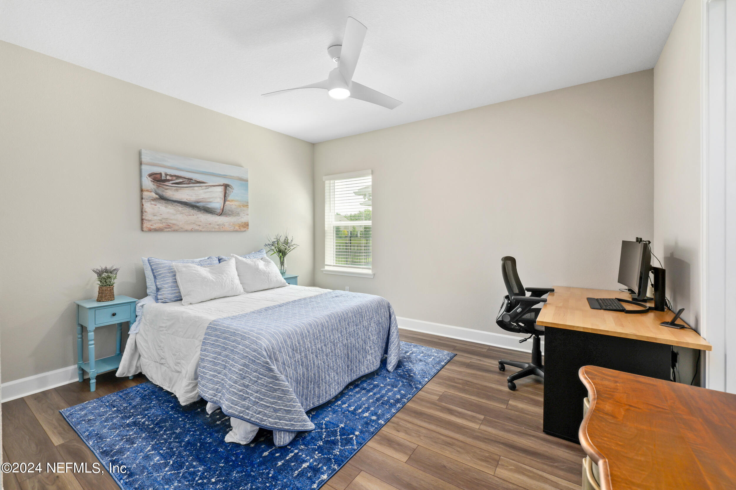 98 Sumter Pl Street St. Augustine, FL 32092 - Photo 62 of 84 a bedroom with a bed wooden floor and a window