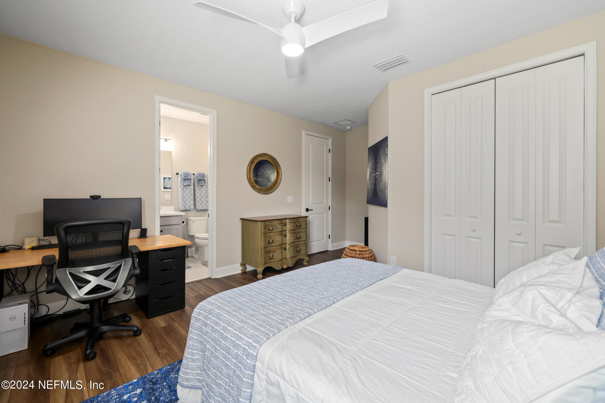 98 Sumter Pl Street St. Augustine, FL 32092 - Photo 63 of 84 a bedroom with a bed and a chair