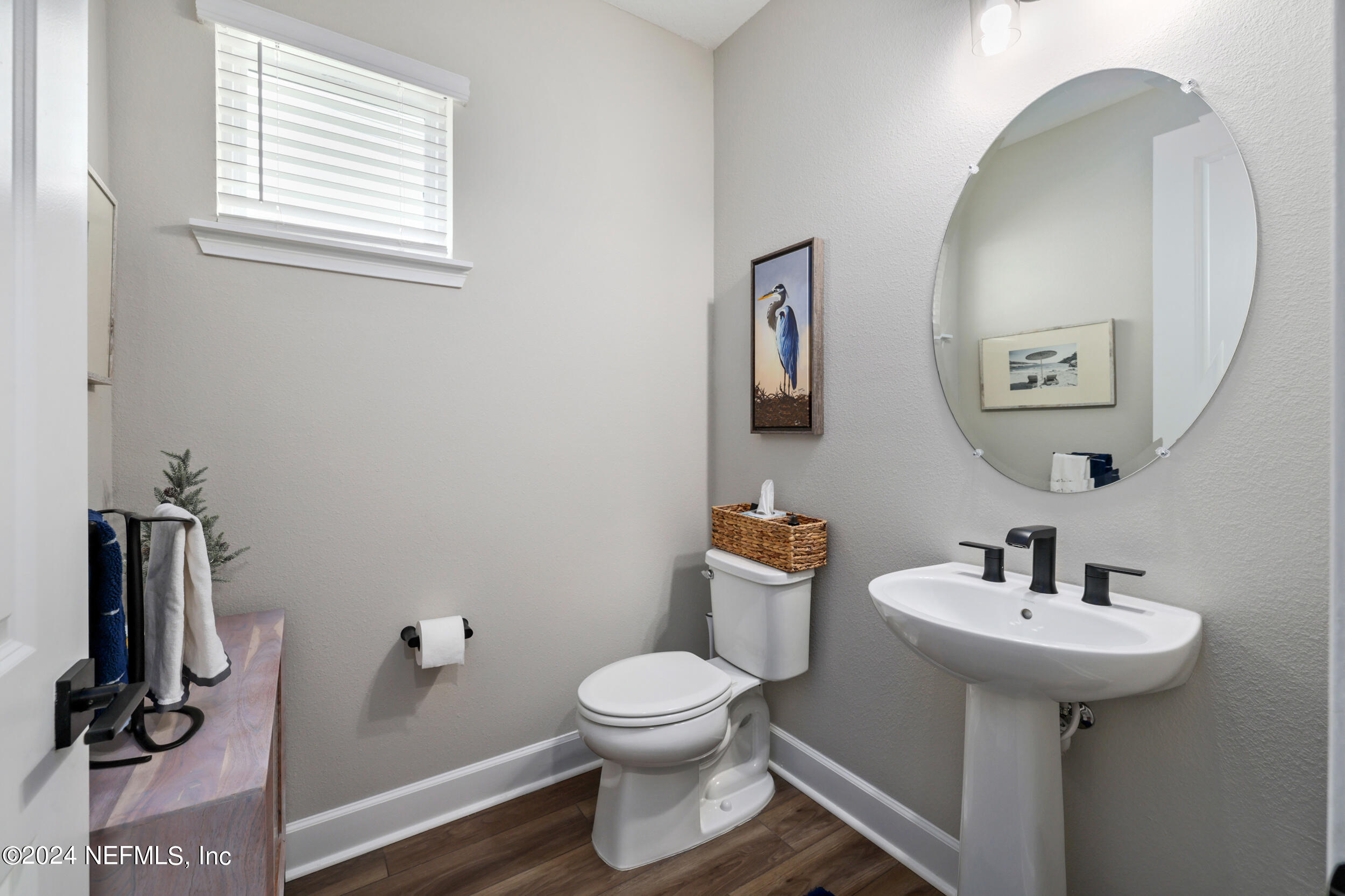 98 Sumter Pl Street St. Augustine, FL 32092 - Photo 8 of 84 a bathroom with a toilet a sink and mirror