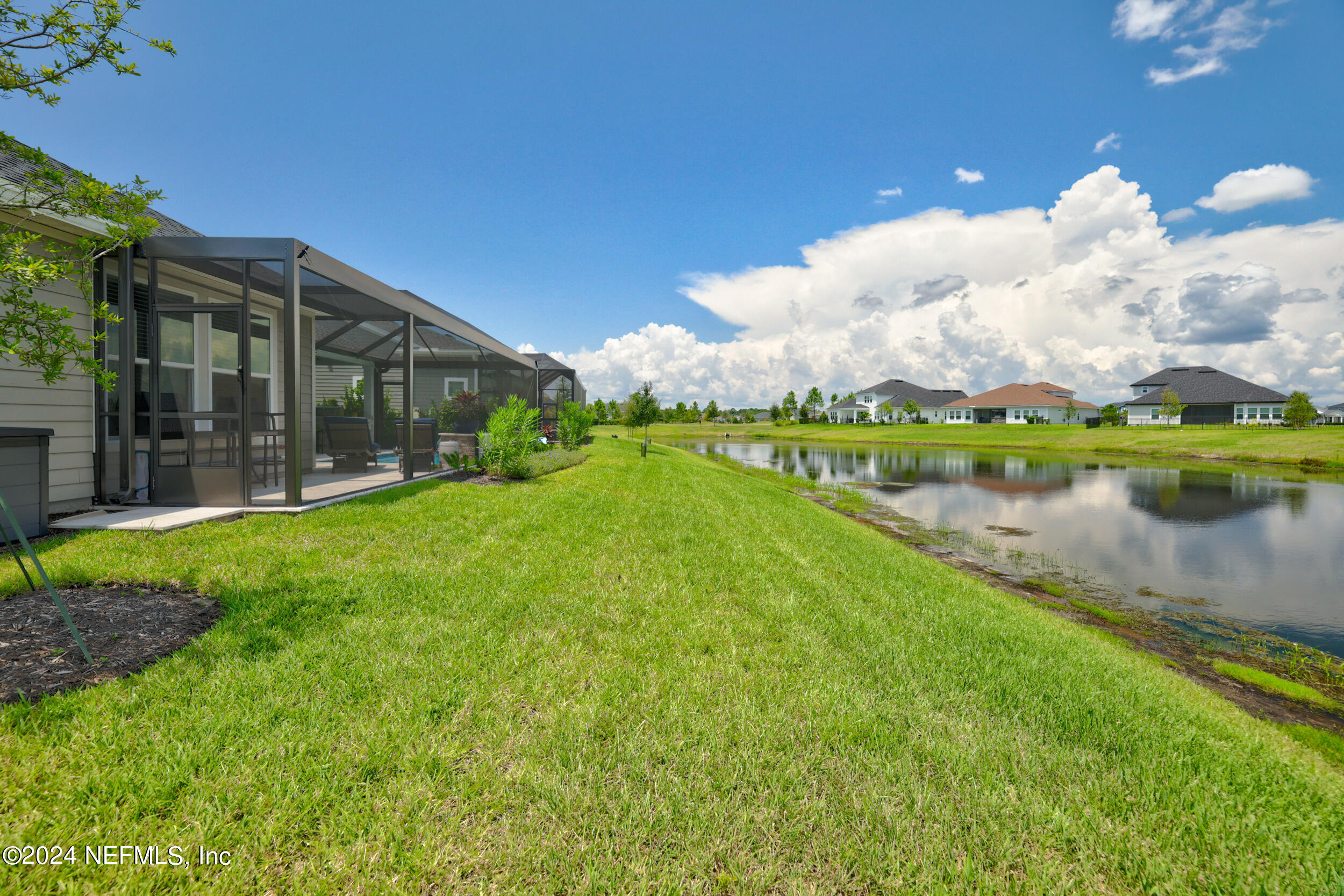 98 Sumter Pl Street St. Augustine, FL 32092 - Photo 82 of 84 a view of a house with a yard and a lake view