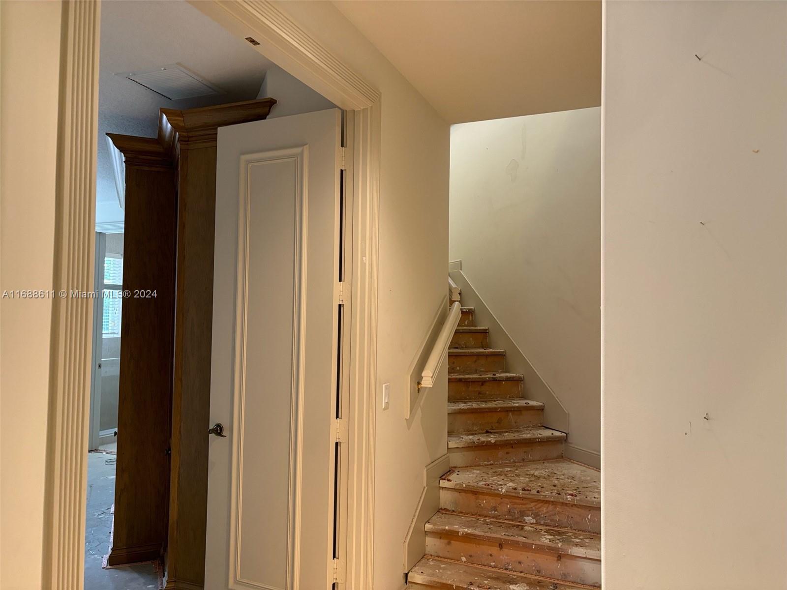 7091 Mallorca Crescent Boca Raton, FL 33433 - Photo 12 of 15 a view of a hallway with staircase