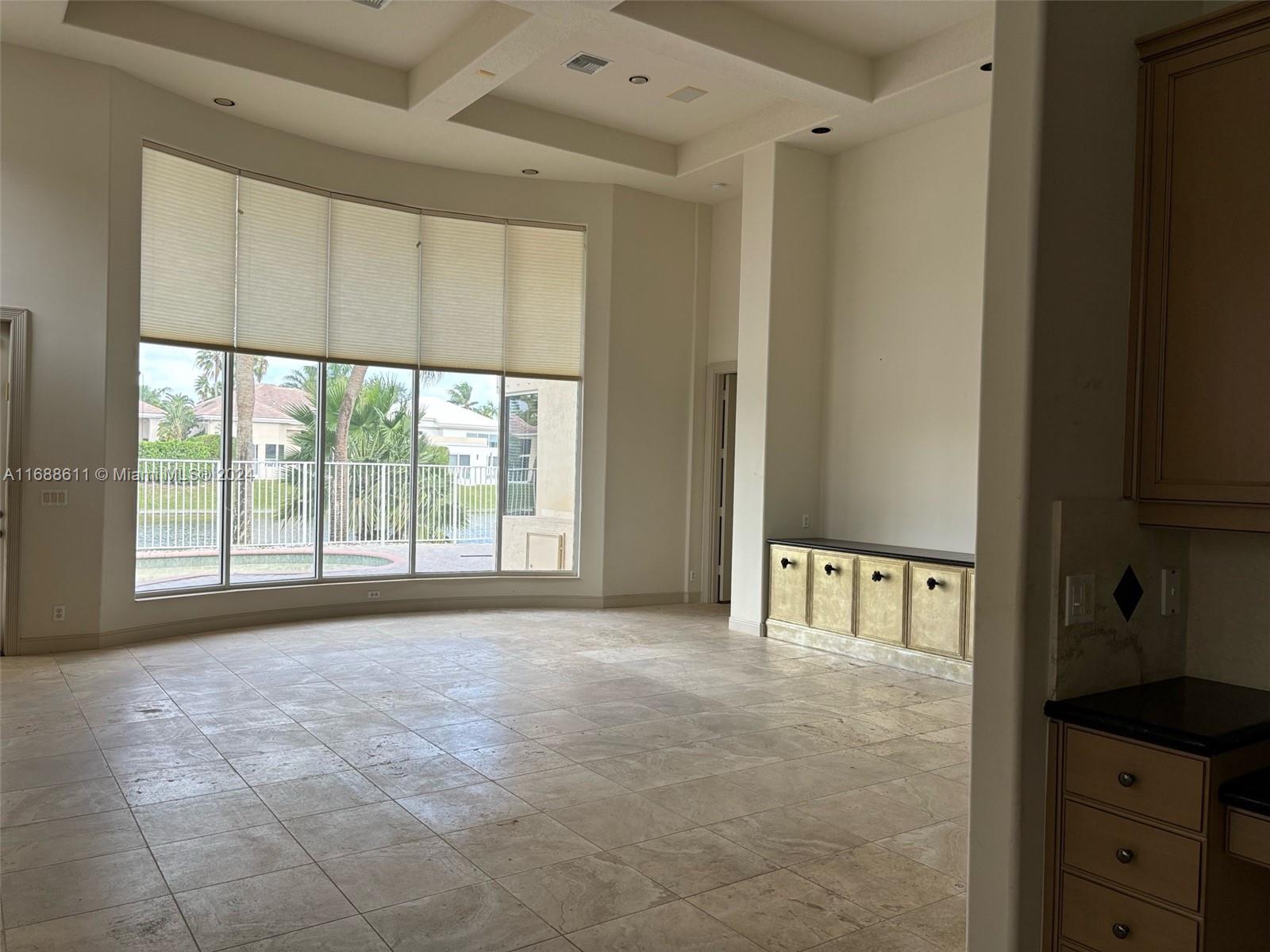 7091 Mallorca Crescent Boca Raton, FL 33433 - Photo 6 of 15 a view of an empty room with a window