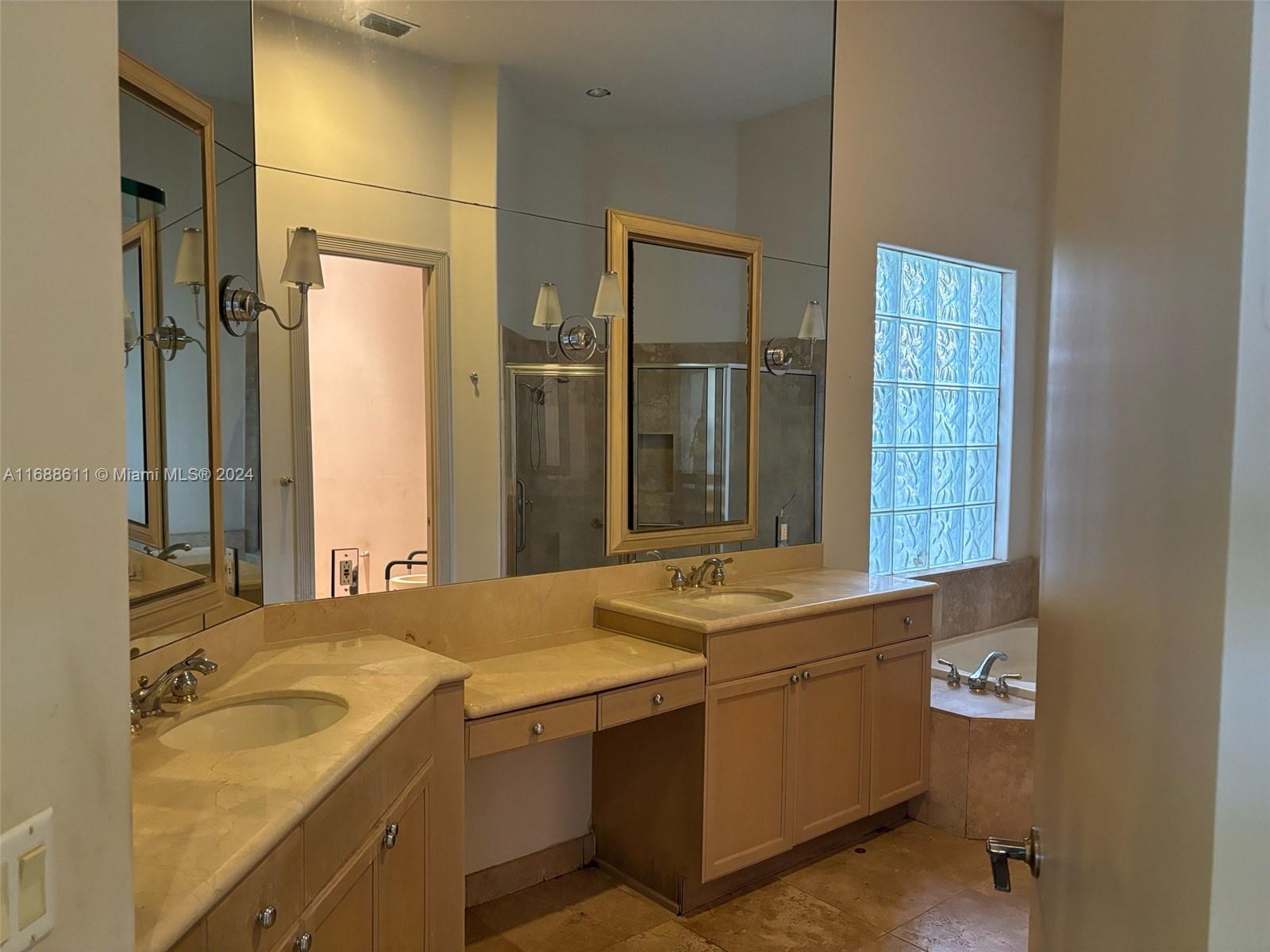 7091 Mallorca Crescent Boca Raton, FL 33433 - Photo 7 of 15 a bathroom with a sink and a mirror