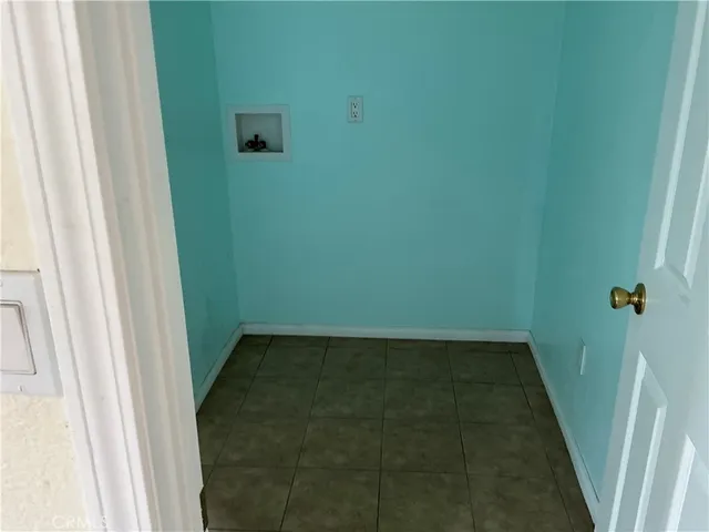 a kitchen with a sink a stove top oven and cabinets