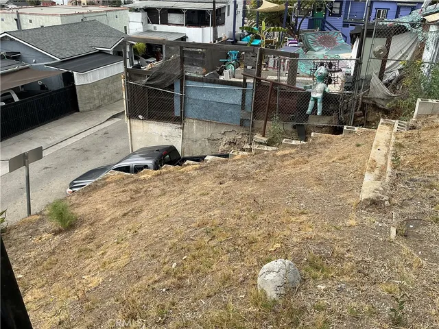 a view of a balcony with two chairs and a table