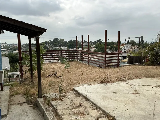 a view of a patio with table and chairs