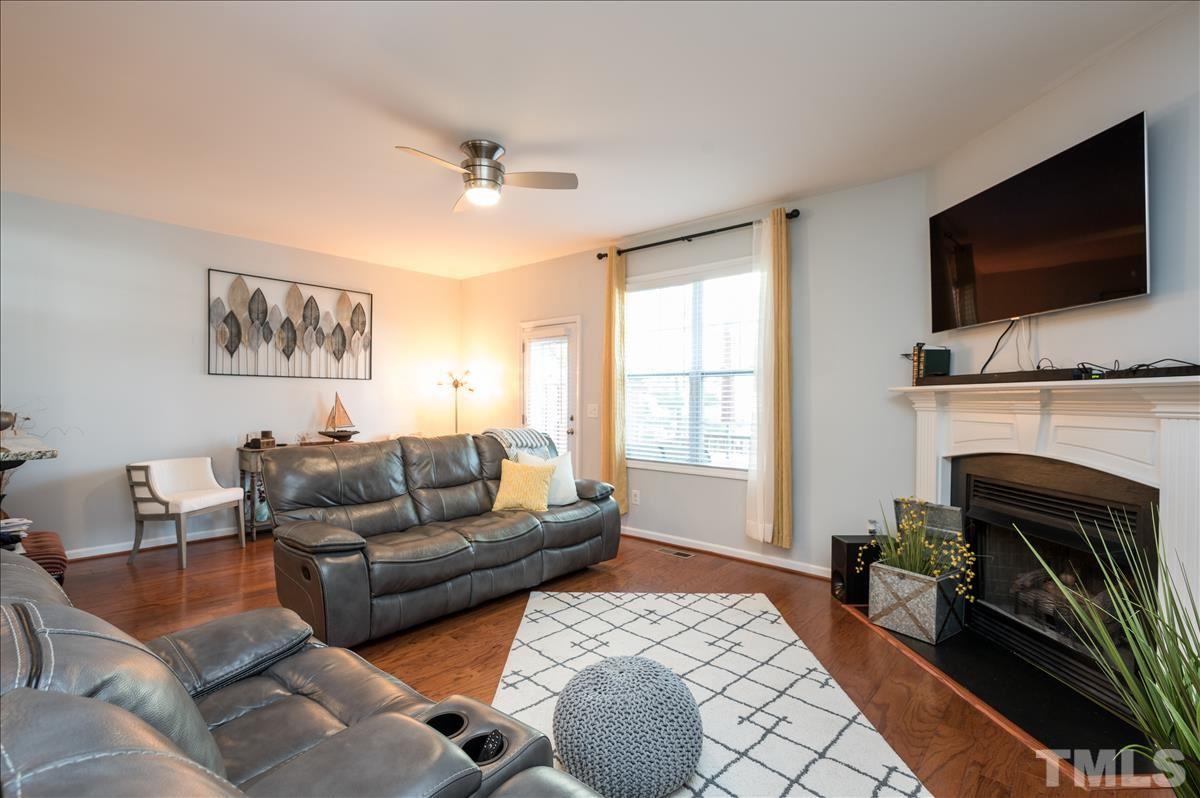 4625 Pat Reed Road Raleigh, NC 27616 - Photo 11 of 28 a living room with furniture fireplace and flat screen tv