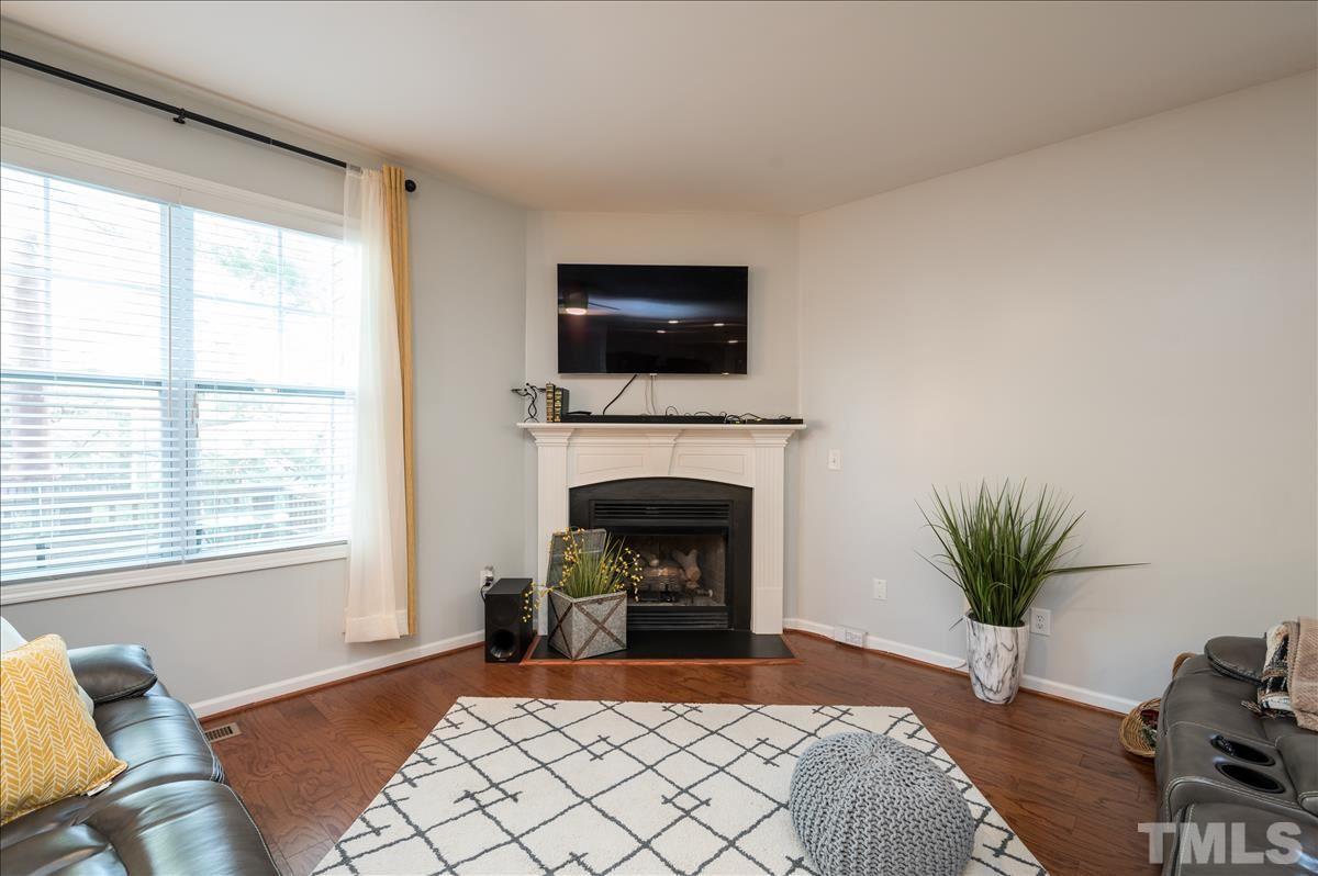 4625 Pat Reed Road Raleigh, NC 27616 - Photo 12 of 28 a living room with furniture fireplace and flat screen tv