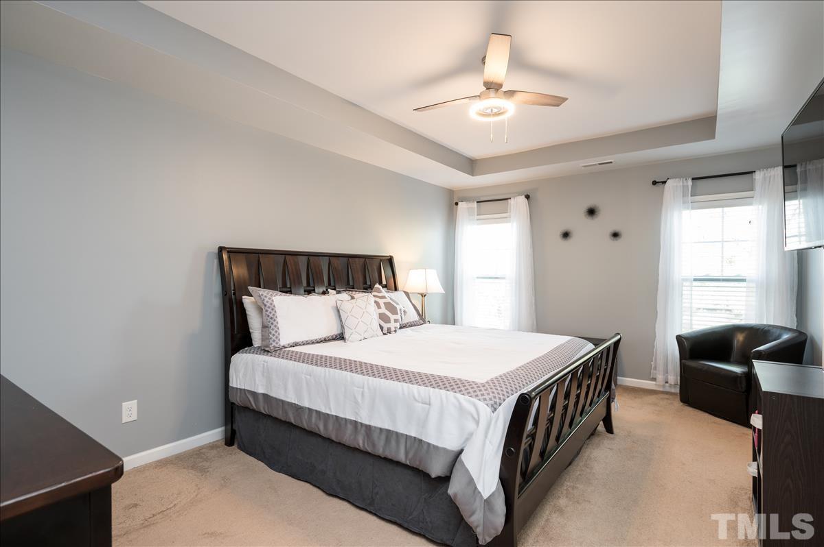 4625 Pat Reed Road Raleigh, NC 27616 - Photo 15 of 28 a bedroom with a bed and window