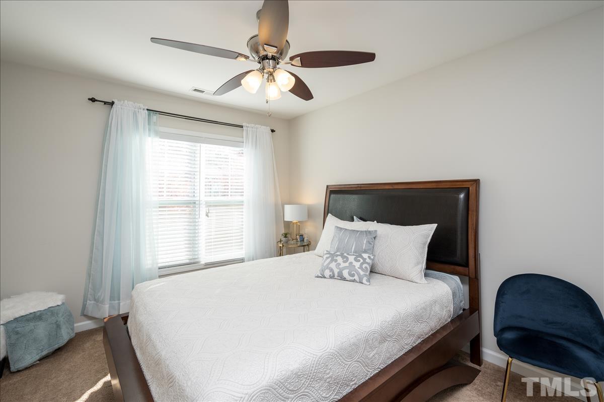 4625 Pat Reed Road Raleigh, NC 27616 - Photo 19 of 28 a bedroom with a bed and a window