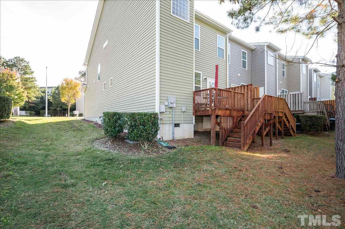4625 Pat Reed Road Raleigh, NC 27616 - Photo 25 of 28 a view of a house with a yard and sitting area