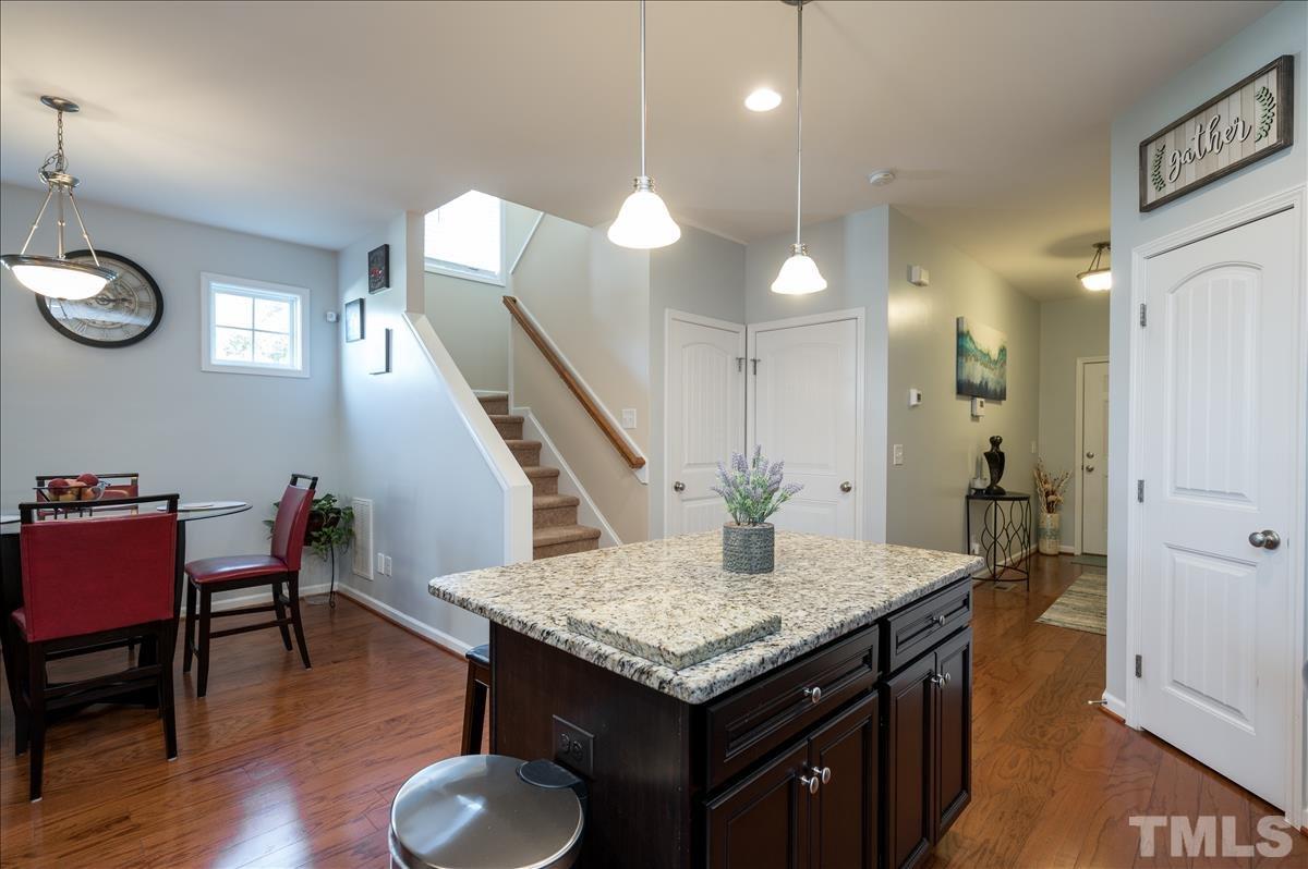 4625 Pat Reed Road Raleigh, NC 27616 - Photo 6 of 28 a kitchen with a table and chairs in it