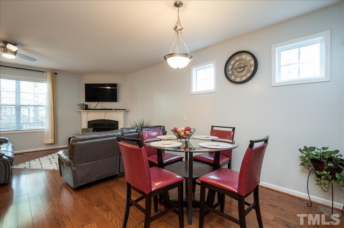 4625 Pat Reed Road Raleigh, NC 27616 - Photo 9 of 28 a view of a dining room with furniture window and wooden floor