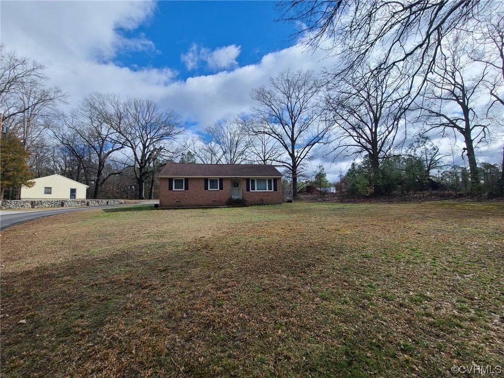 11231 Chester Road Chester, VA 23831 - Photo 1 of 18 a view of a house with a yard