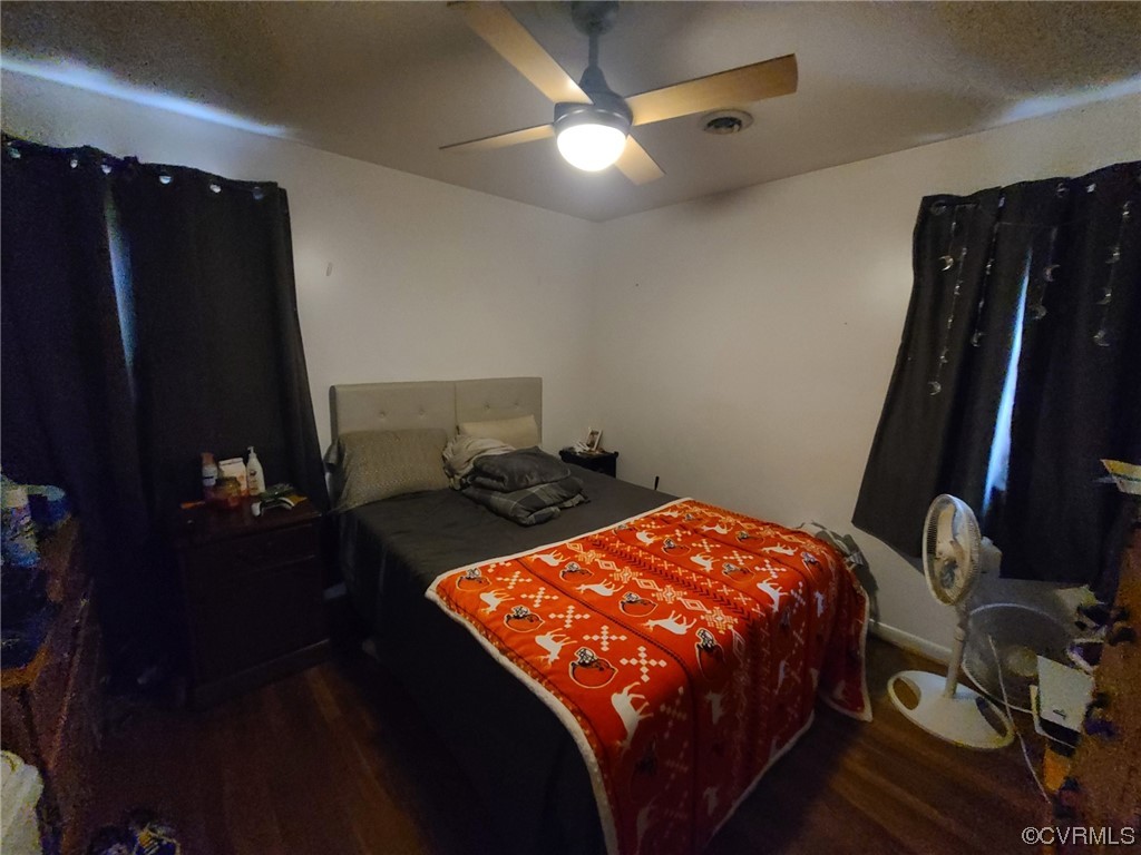 11231 Chester Road Chester, VA 23831 - Photo 11 of 18 a bed sitting in a bedroom next to a window