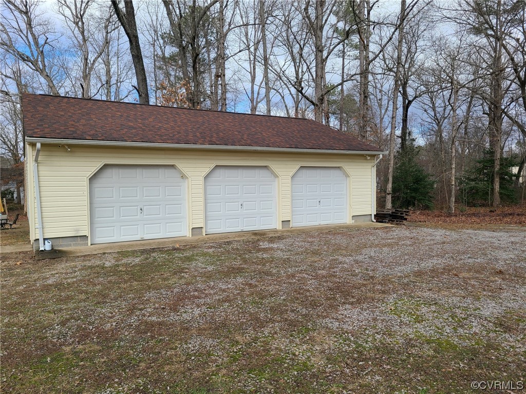 11231 Chester Road Chester, VA 23831 - Photo 16 of 18 a house with trees in front of it