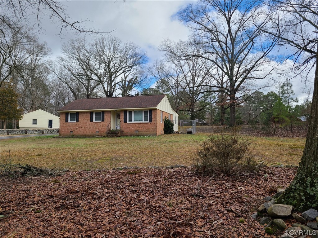 11231 Chester Road Chester, VA 23831 - Photo 2 of 18 a view of a house with a yard
