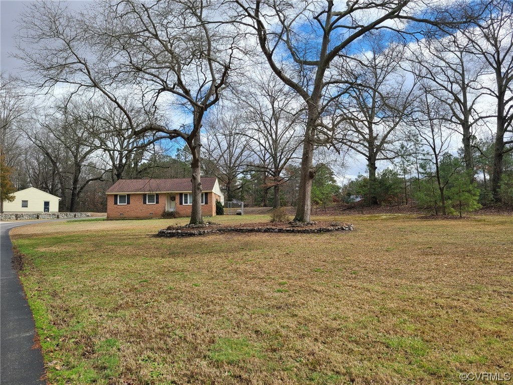 11231 Chester Road Chester, VA 23831 - Photo 3 of 18 a view of street with large trees