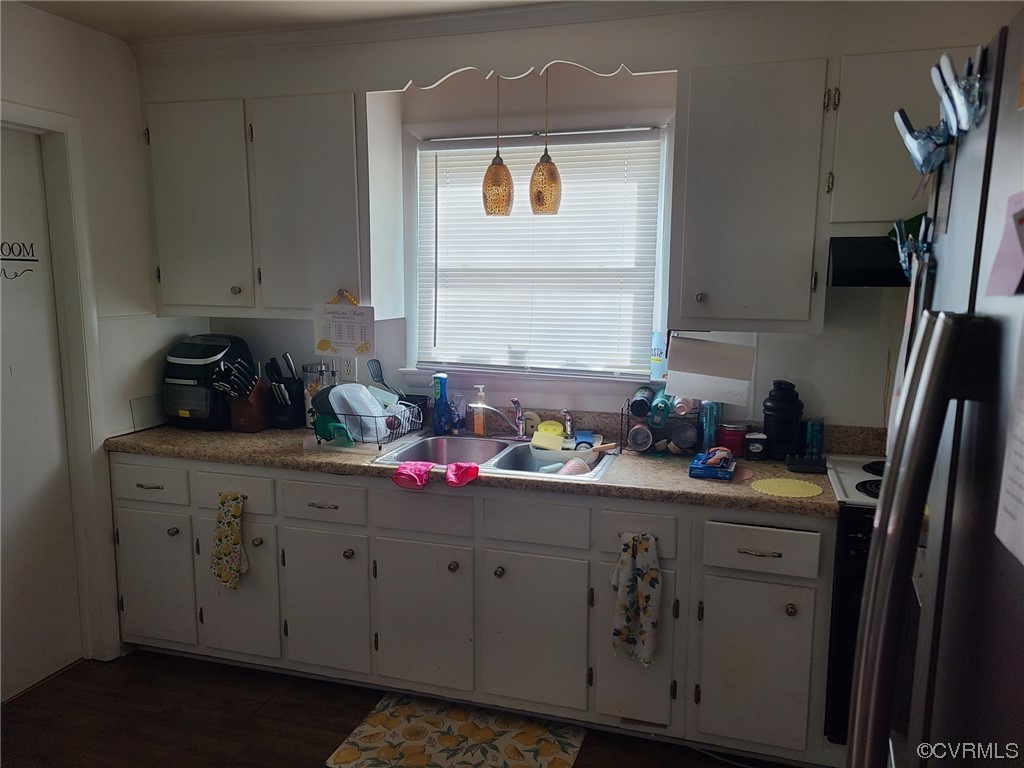 11231 Chester Road Chester, VA 23831 - Photo 4 of 18 a kitchen with cabinets appliances and a sink