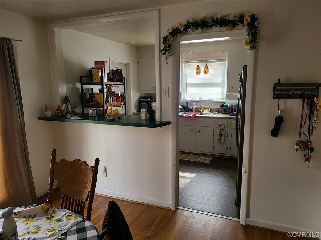 11231 Chester Road Chester, VA 23831 - Photo 5 of 18 a view of a workspace room with wooden floor and furniture