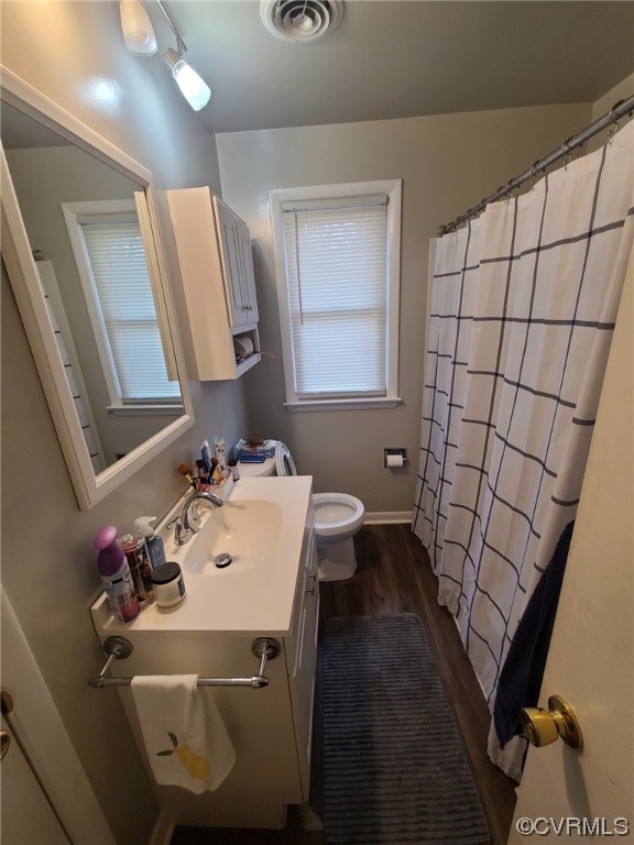 11231 Chester Road Chester, VA 23831 - Photo 10 of 18 a bathroom with a sink and mirror with toilet