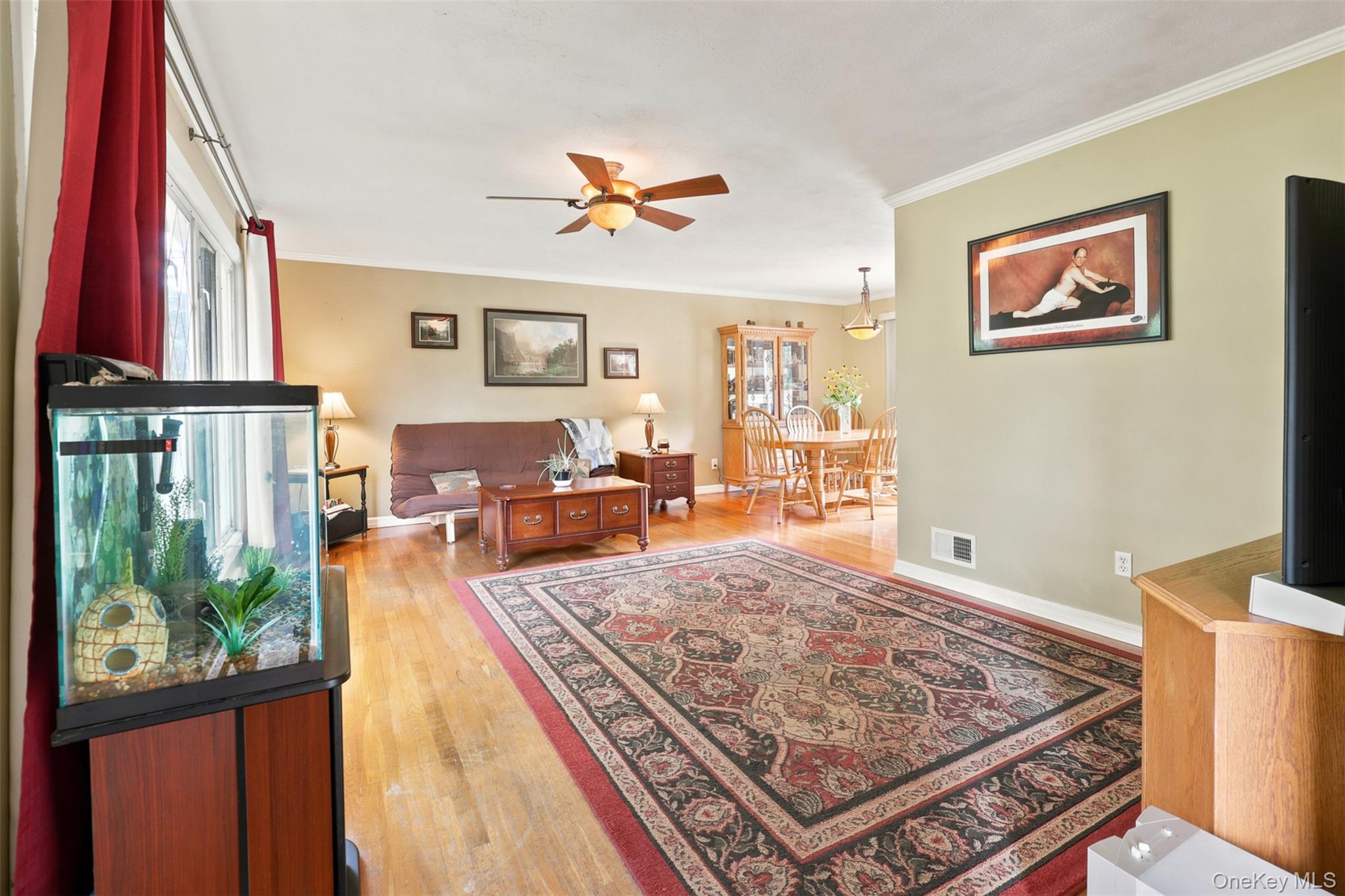 48 Ryerson Road New Hampton, NY 10958 - Photo 4 of 33 Hardwood-style flooring throughout, complemented by a ceiling fan with integrated lighting
