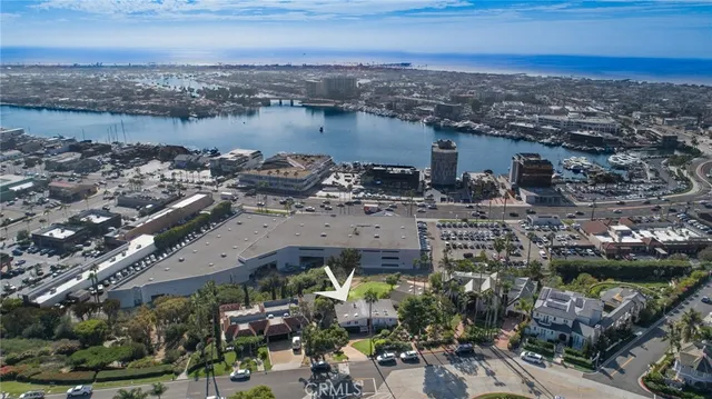 an aerial view of a house with a lake view