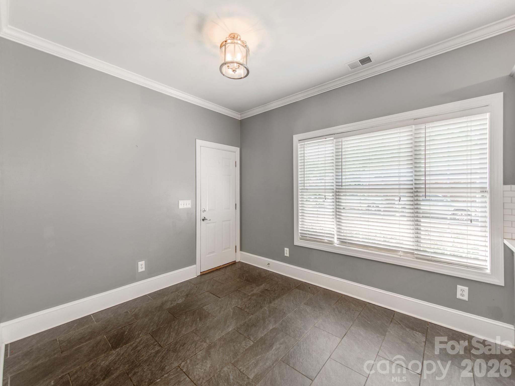 783 Sloan Street Denver, NC 28037 - Photo 21 of 44 a view of an empty room with a window