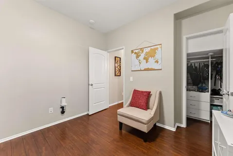 a bedroom with a bed and a couch