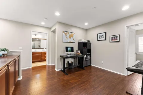 a view of a livingroom with furniture and a flat screen tv