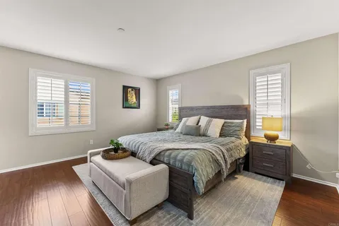 a bedroom with a bed and a couch