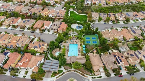 an aerial view of residential houses with outdoor space