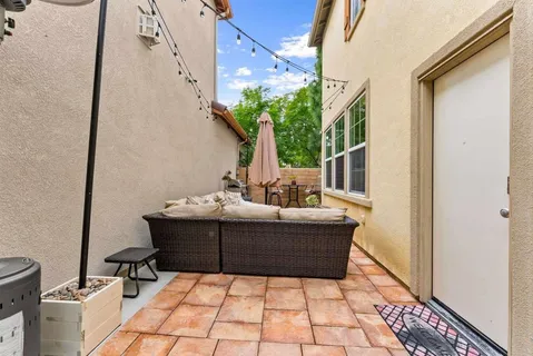 a front view of a house with a garden and garage